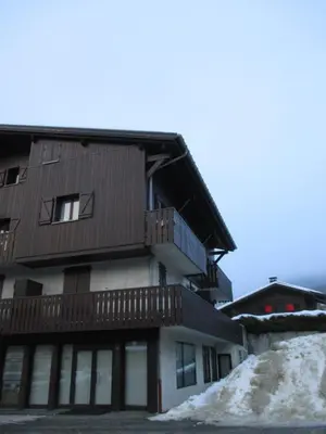 a view from the balcony of a house with mountains in the background at Beau duplex lumineux à la montagne Nice flat just underneath MtBlanc in Les Houches