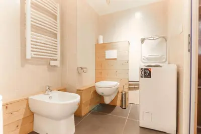 a small bathroom with a toilet and a sink at L'Outa - Center of Chamonix - Mont-Blanc view in Chamonix-Mont-Blanc