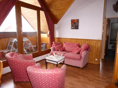 a living room with two couches and a table at Résidence L'enclave - Enclave I652 MAE-3414 in Les Contamines-Montjoie