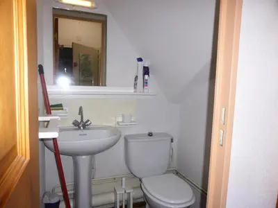 a bathroom with a toilet and a sink and a mirror at Résidence L'enclave - Enclave I652 MAE-3414 in Les Contamines-Montjoie