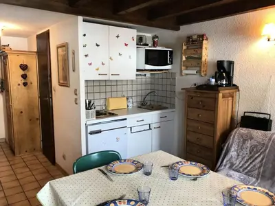 a kitchen with a table with plates on it at Résidence Edelweiss - Edelweiss B3 MAE-0844 in Megève
