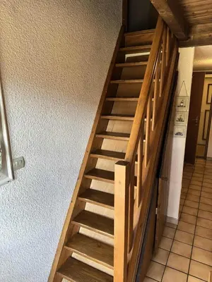 a wooden staircase in a room with a stair case at Résidence Edelweiss - Edelweiss B3 MAE-0844 in Megève