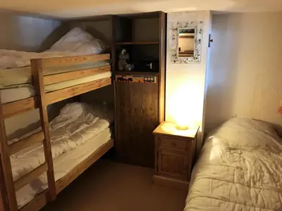 a bedroom with two bunk beds and a lamp at Résidence Edelweiss - Edelweiss B3 MAE-0844 in Megève