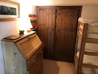 a bedroom with a wooden cabinet and a bunk bed at Résidence Edelweiss - Edelweiss B3 MAE-0844 in Megève