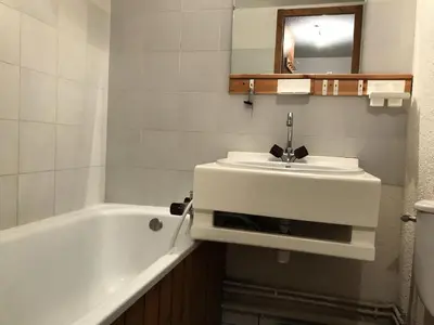 a bathroom with a sink and a bath tub at Résidence Edelweiss - Edelweiss B3 MAE-0844 in Megève