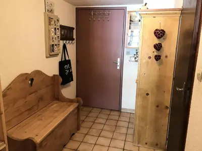 a room with a wooden bench next to a door at Résidence Edelweiss - Edelweiss B3 MAE-0844 in Megève