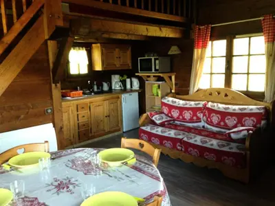 a living room with a table and a couch at Résidence Mazot De La Princesse - Chalet de la Princesse MAE-0864 in Megève