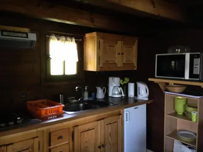 a kitchen with a sink and a microwave at Résidence Mazot De La Princesse - Chalet de la Princesse MAE-0864 in Megève