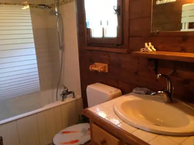 a bathroom with a sink and a shower and a toilet at Résidence Mazot De La Princesse - Chalet de la Princesse MAE-0864 in Megève