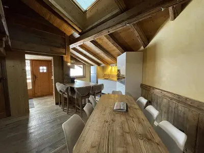 a kitchen and dining room with a wooden table and chairs at Appartement Cosy 3 Chambres, Centre-Ville, Proche Pistes, Parking, Wifi - FR-1-572-273 in Arâches-la-Frasse