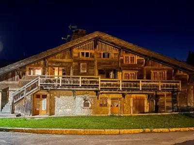 a large wooden house with a large balcony at Appartement Cosy 3 Chambres, Centre-Ville, Proche Pistes, Parking, Wifi - FR-1-572-273 in Arâches-la-Frasse
