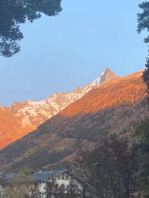 a mountain in the distance with a building in the foreground at Chamonix - Majestic vue Mont Blanc in Chamonix-Mont-Blanc