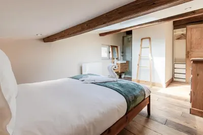 a bedroom with a large bed with a swan on it at Chalet Kieppi - View off Mont-Blanc range in Les Houches