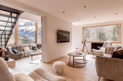 a living room with a view of a mountain at Chalet Kieppi - View off Mont-Blanc range in Les Houches