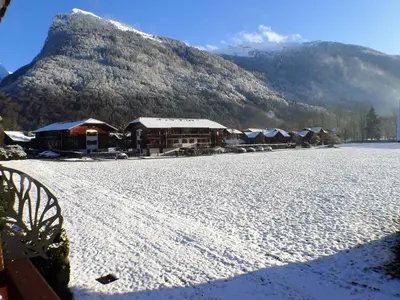 a snow covered field in front of a mountain at Appartement 2 pièces avec balcon à Samoëns, parking inclus - FR-1-629-121 in Samoëns