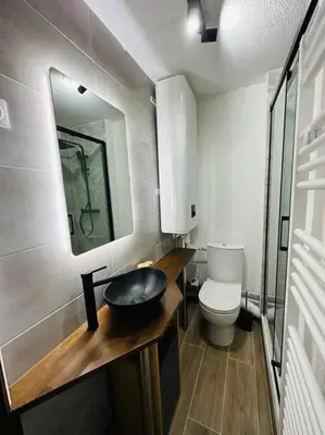 a bathroom with a sink and a toilet at Studio Hyper centre in Les Carroz d'Araches
