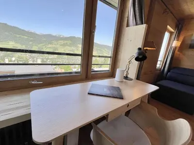 a desk with a book on it in a room with a window at Appartement 3 pièces + cabine à Megève, 6 couchages, proche pistes et téléphérique - FR-1-597-170 in Megève