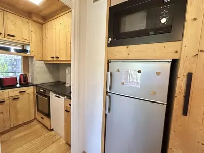 a kitchen with a refrigerator and a microwave at Appartement 3 pièces + cabine à Megève, 6 couchages, proche pistes et téléphérique - FR-1-597-170 in Megève