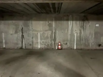 an empty parking garage with a traffic cone in it at Appartement 3 pièces + cabine à Megève, 6 couchages, proche pistes et téléphérique - FR-1-597-170 in Megève