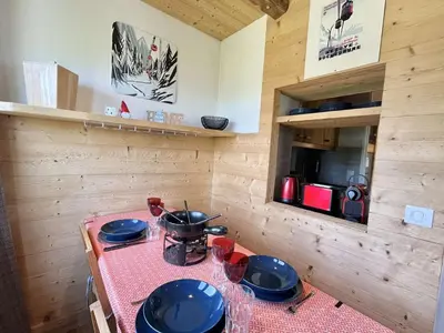 a kitchen with a table with pots and pans on it at Appartement 3 pièces + cabine à Megève, 6 couchages, proche pistes et téléphérique - FR-1-597-170 in Megève