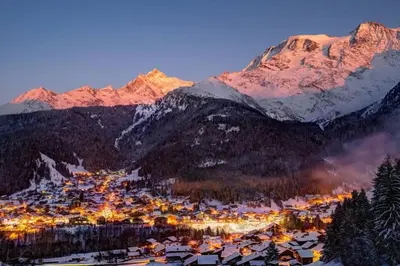 a town in the mountains with a snow covered mountain at Studio agréable in Les Contamines-Montjoie