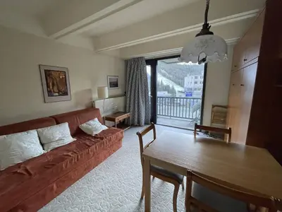 a living room with a couch and a table at Studio cosy Flaine Forum, balcon sud, à deux pas des pistes, idéal 3 pers. - FR-1-687-114 in Arâches-la-Frasse