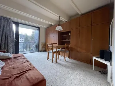 a bedroom with a table and a dining room at Studio cosy Flaine Forum, balcon sud, à deux pas des pistes, idéal 3 pers. - FR-1-687-114 in Arâches-la-Frasse