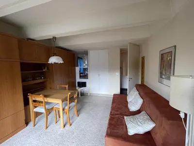a living room with a couch and a table at Studio cosy Flaine Forum, balcon sud, à deux pas des pistes, idéal 3 pers. - FR-1-687-114 in Arâches-la-Frasse