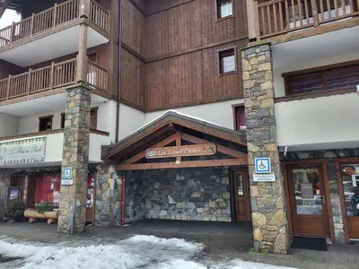 a building with a sign in front of it at Ecrins A4, 1 bedroom apartment with bunk room, central Samoëns in Samoëns