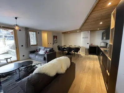 a living room with a couch and a table at Appartement 5 pièces au pied des pistes, 8 pers, avec parking et WiFi - FR-1-572-277 in Arâches-la-Frasse