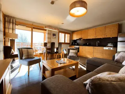 a living room with a couch and a table at Appartement lumineux T3 pour 4-6 pers avec WIFI et parking à Samoëns - FR-1-624-128 in Samoëns