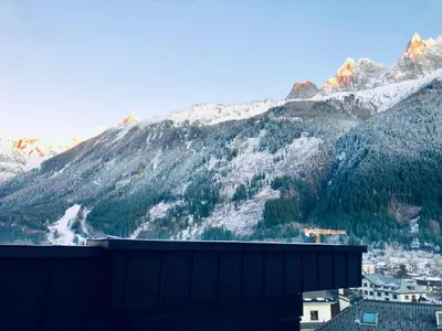 a view of a mountain range with snow covered mountains at Design loft in Chamonix Center in Chamonix-Mont-Blanc