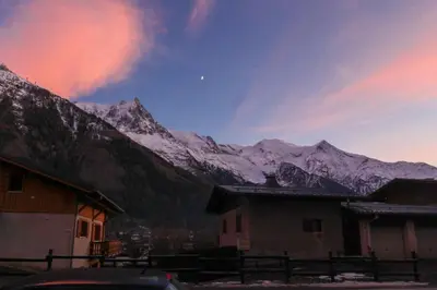 a view of a snow covered mountain range with buildings at Les Pècles Mt Blanc - Chamonix Center in Chamonix-Mont-Blanc