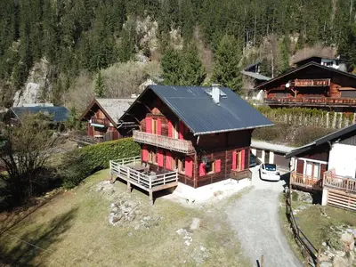 an overhead view of a log cabin with red windows at Primerose - Historic Chalet - Garden - Central - 5 bedrooms - Mont-Blanc Views in Chamonix-Mont-Blanc