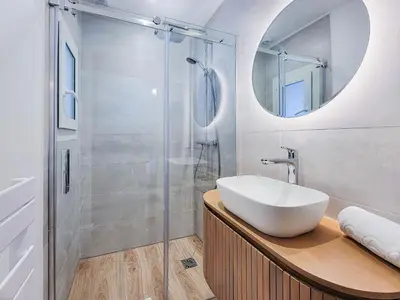 a bathroom with a sink and a shower at Primerose - Historic Chalet - Garden - Central - 5 bedrooms - Mont-Blanc Views in Chamonix-Mont-Blanc