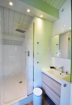 a bathroom with a shower and a sink and a tub at Appartement Bellevue - centre ville in Chamonix-Mont-Blanc