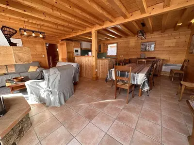 a bedroom with a bed and a desk in a cabin at Chalet 4 chambres, 9 pers, pied des pistes, garage 2 voitures - FR-1-572-279 in Arâches-la-Frasse