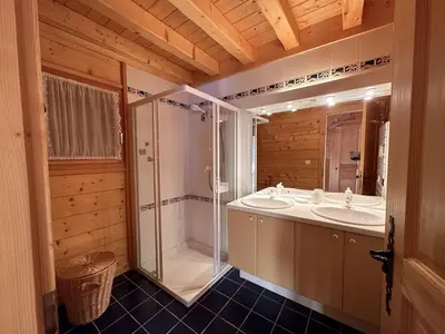 a log cabin with snow on the ground in front at Chalet 4 chambres, 9 pers, pied des pistes, garage 2 voitures - FR-1-572-279 in Arâches-la-Frasse
