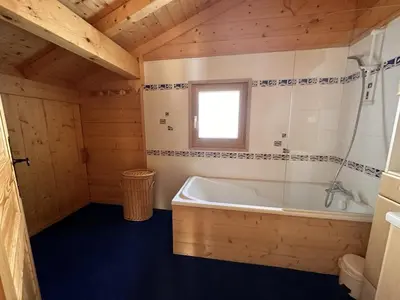 a kitchen with wooden cabinets and a counter top at Chalet 4 chambres, 9 pers, pied des pistes, garage 2 voitures - FR-1-572-279 in Arâches-la-Frasse