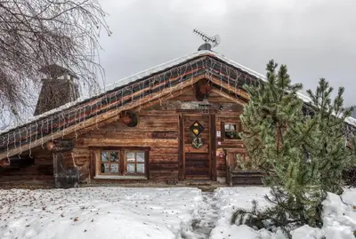 a log cabin with snow on the roof at Chalet Edelweiss in Megève
