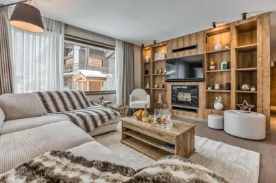 a living room with a couch and a table at Kristal in Megève