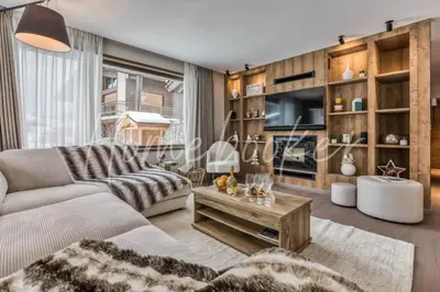 a living room with a couch and a table at Kristal in Megève