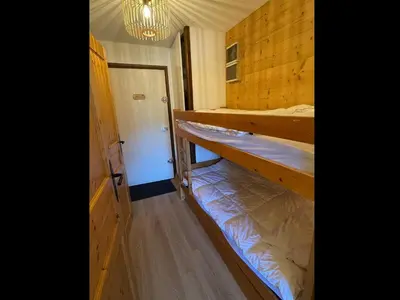 a small room with two bunk beds in it at Studio familial pour 4 personnes avec parking à Samoëns - FR-1-629-122 in Samoëns