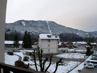 a view of a town with a snow covered mountain at Studio familial pour 4 personnes avec parking à Samoëns - FR-1-629-122 in Samoëns