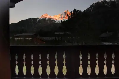 a view of a mountain from a balcony at Chalet Ancelles - Les Praz - Golf - Vue Mont-Blanc - Randonnées in Chamonix-Mont-Blanc