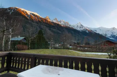 a balcony with a view of a mountain at Chalet Ancelles - Les Praz - Golf - Vue Mont-Blanc - Randonnées in Chamonix-Mont-Blanc