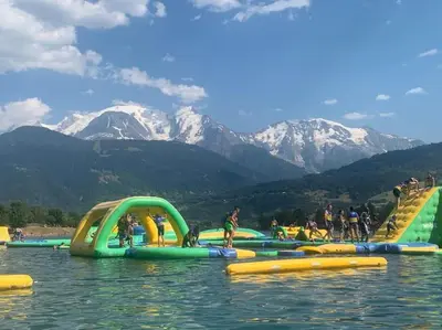 a group of inflatable slides in the water at Pom Pom, 3 bedroom apt with stunning mountain views-Samoëns in Samoëns