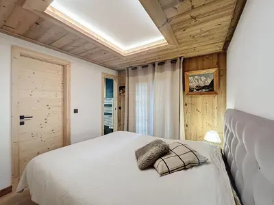 a living room with a couch and a table at Plein soleil in Saint-Gervais-les-Bains
