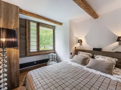 a bedroom with a bed and a window at Appartement à Megève, proche ski et golf - FR-1-569-67 in Megève