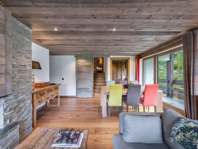 a living room with a table and colorful chairs at Appartement à Megève, proche ski et golf - FR-1-569-67 in Megève